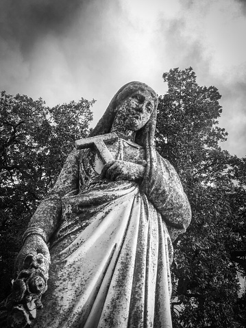 Saint Catherine depicted on a grave marker; Marysville Historic Cemetery, California.