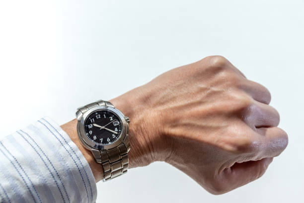 istock man's wrist wearing a wristwatch 1481582372