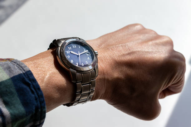 istock man's wrist wearing a wristwatch 1481582375