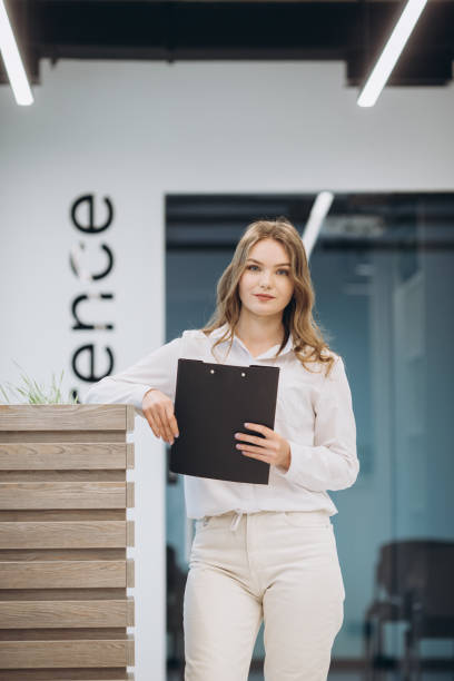 istock businesswoman holding a document in an office 1481582643