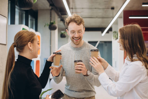 istock Group of coworkers taking a coffee break at the office 1481582698