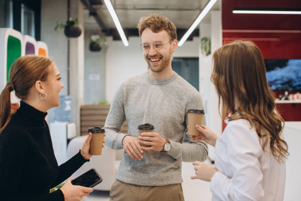 istock Group of coworkers taking a coffee break at the office 1481582701