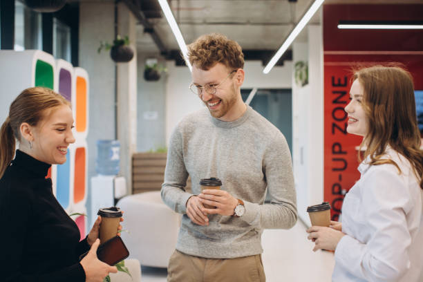 istock Group of coworkers taking a coffee break at the office 1481582702
