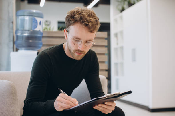 istock Businessman edits a report before the meeting 1481584321
