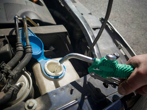 istock Filling water in car washer tank 1481587437