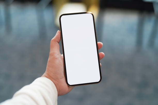 istock Women's hands holding cell telephone blank copy space screen. smartphone with blank white screen isolated. smart phone with technology concept 1481589036