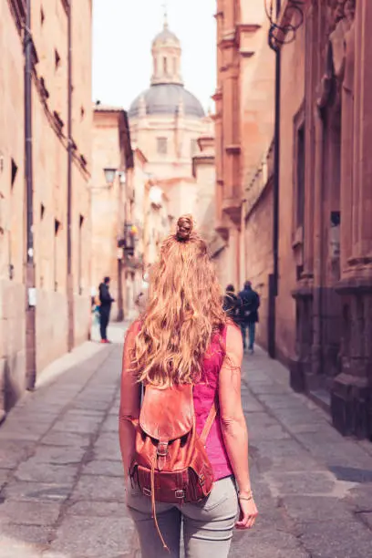 Tourism at Salamanca, woman walking in the street- Castile and leon in Spain