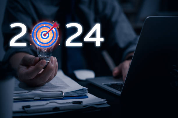 istock bulb light innovation and creativity, with a target goal of 2024. success and progress in business marketing. The glowing bulb represents a brilliant idea and a strategic planning target goal. 1481591299
