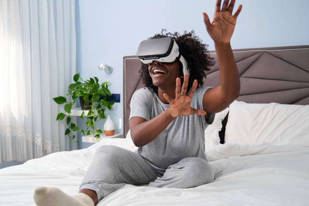 Immersive virtual reality experience for young African woman from her bed.