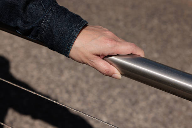 istock A woman's hand on stainless steel handrail. 1481594857