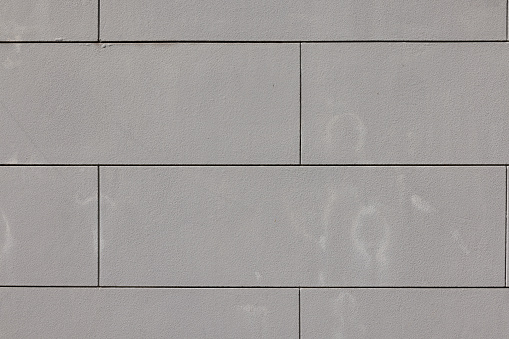 Part of a blank painted concrete wall with stains.