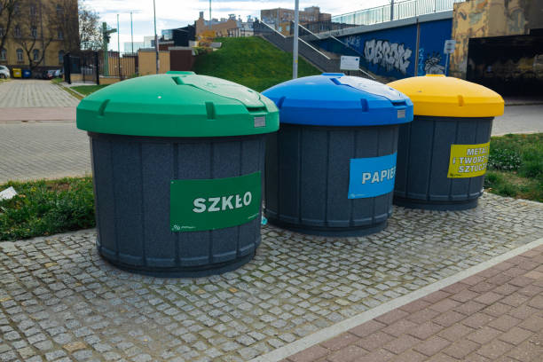 istock Waste sorting bins, blue, yellow, green and red. There is a sign at the top indicating the type of waste 1481596606