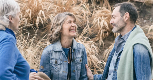 istock Mature people talking next to a rural path 1481598119