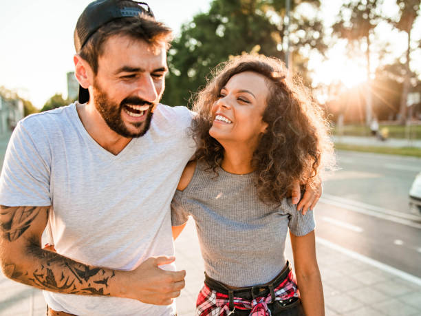 istock Cheerful couple having fun while walking embraced in nature. 1481599210