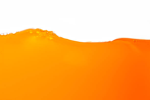 istock Orange juice isolated white background,orange juice texture on white background,Close up bright orange juice texture for health and nature waves 1481599441