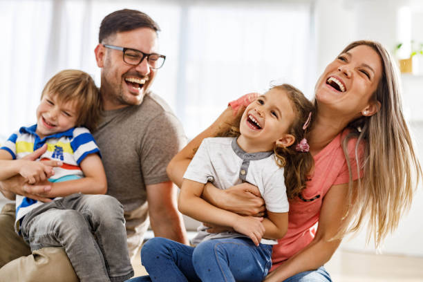 istock Young cheerful parents having fun with their kids at home. 1481601048