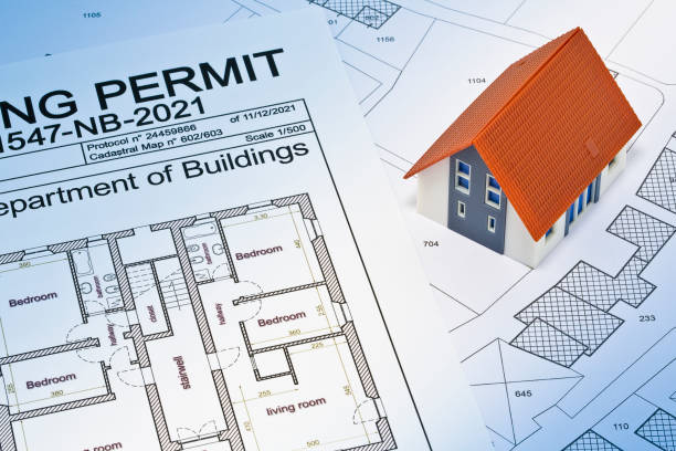 istock Building Permit concept with imaginary building approvation and residential home against a cadastral map and General Urban Planning 1481601333