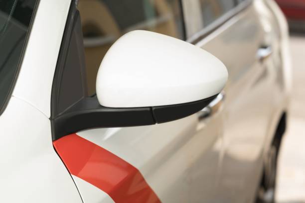 istock Close-up view of a white car mirror with a bright red stripe across the surface. 1481601403