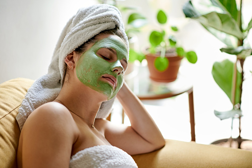 Face mask, sleeping and woman with skincare cream for skin detox, cosmetics hydration or beauty. Relax sleep, spa salon or tired person with luxury facial treatment, healthcare or home wellness
