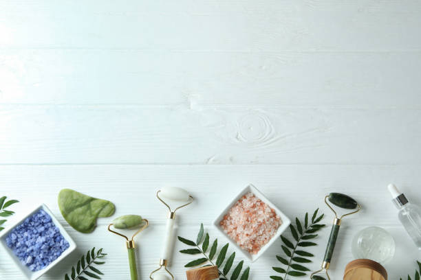 istock Skin care concept with face rollers on white wooden background 1481605208