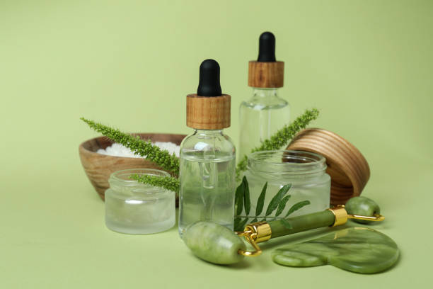 istock Skin care concept with face roller on green background 1481605232
