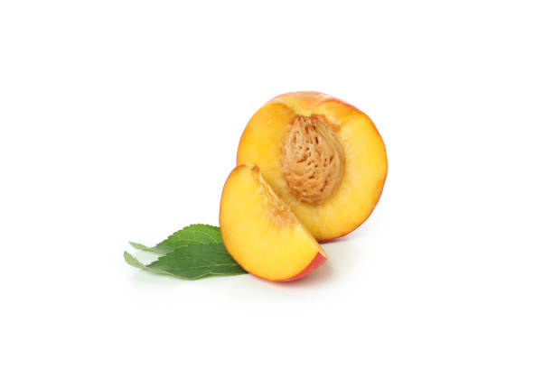 istock Half of peach fruit, slice and leaves isolated on white background 1481606558