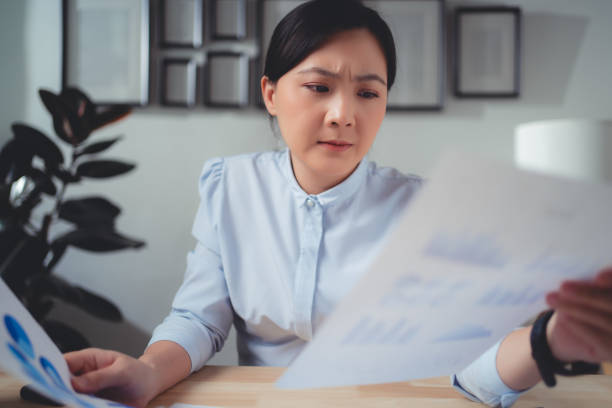 istock Asian woman have a problem with work, sitting at home office. 1481606821