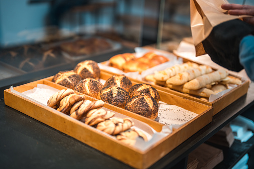 Elevated view on freshly baked goods on a tray in an artisan bakery.