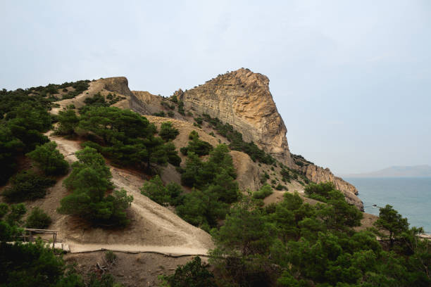 Coustline rock formations and mountain with trails to climb