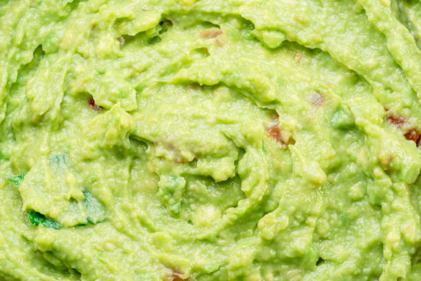 Guacamole sauce texture closeup.