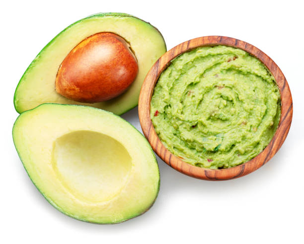istock Guacamole sauce and avocado fruit cross cut isolated on white background. 1481610031