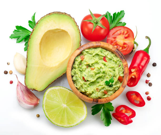 istock Guacamole and guacamole ingredients isolated on white background. Flat lay. 1481610040