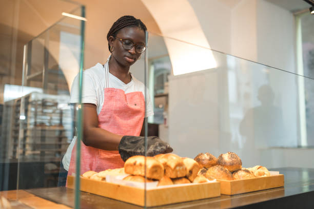 istock Lovely Black Female Preparing Order In An Artisan Bakery 1481610998