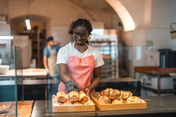 istock Lovely Black Female Preparing Order In An Artisan Bakery 1481611020