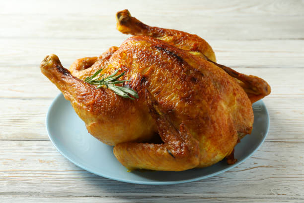 istock Plate with roast turkey on white wooden table 1481613536