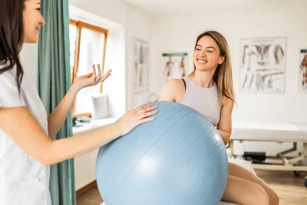 istock Young woman talking with physical therapist 1481613996