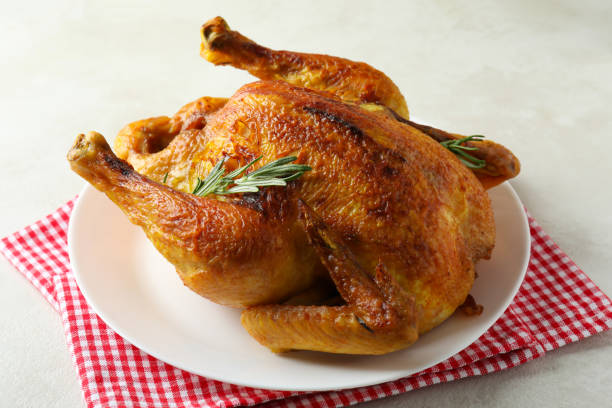 istock Plate with roast turkey on white textured table 1481614176