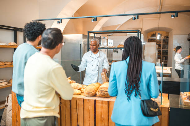 istock Diverse Customers Buying Baked Goods In Small Artisan Bakery 1481614229