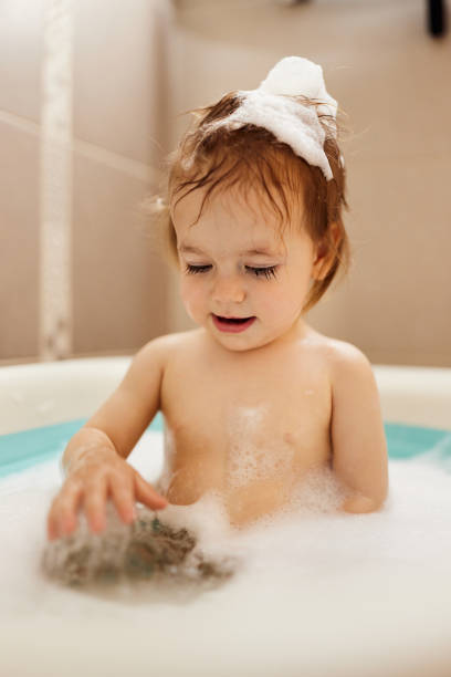 istock Cute little baby having fun in bath tube 1481616539
