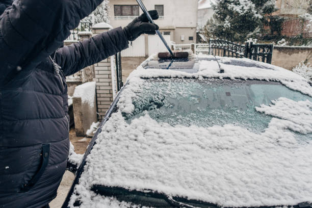 istock Winter, a man cleans the snow from the car 1481616570