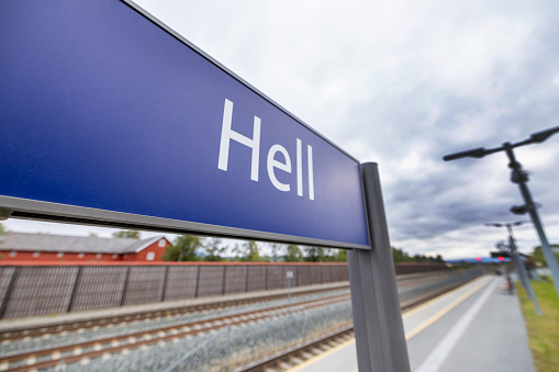 A view of the sign Hell in Hell city, shot at the railway station.\nHumour, famous place visited by tourist