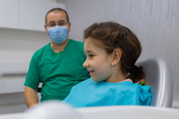 istock Schoolgirl at The Dentist 1481619653