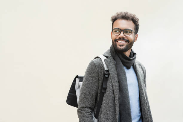 istock Handsome smiling man wearing warm clothes looking up, isolated 1481620559