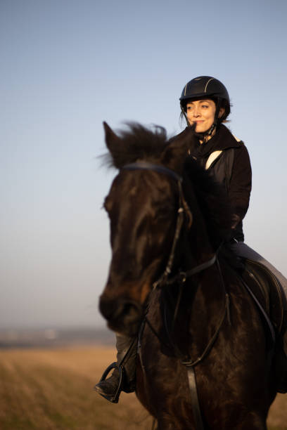 istock Female riding outdoors on her lovely horse 1481627952