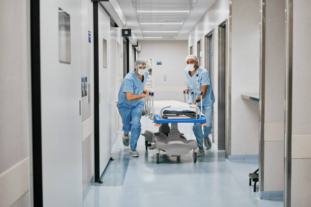 istock Paramedics pushing a gurney through hospital corridor during emergency 1481627971