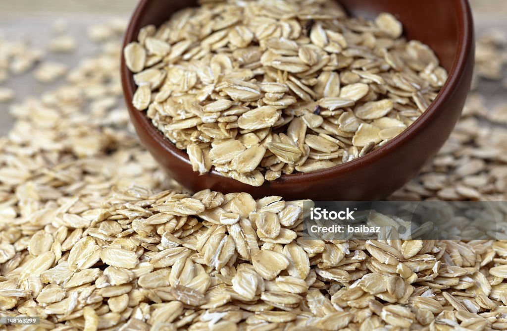 Bowl of oat flakes Brown bowl of oat flakes Bowl Stock Photo