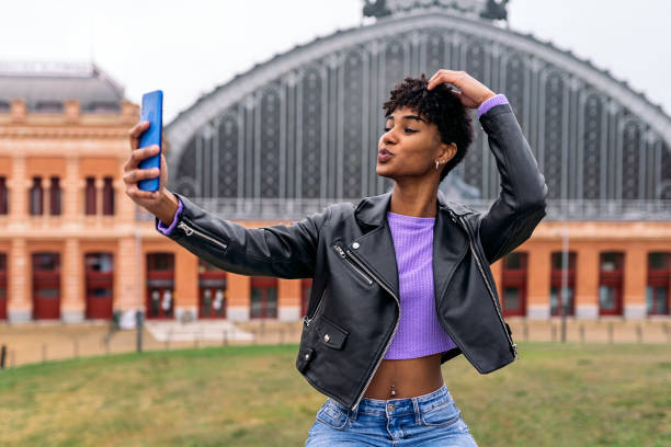 Afro Girl Taking Selfie Stock photo of beautiful african girl taking selfie in the streets of Madrid. selfie madrid photos stock pictures, royalty-free photos & images