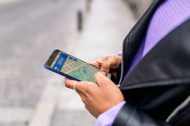 istock unrecognized afro woman looking at a map in her phone 1481633388
