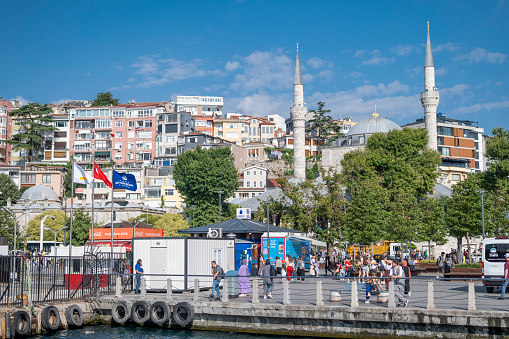 Istanbul, Turkey - June 29, 2023: Uskudar harbor and mosque in Istanbul, Turkey