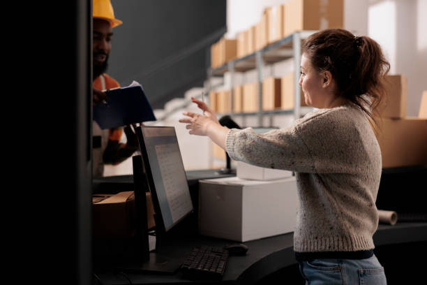 istock Warehouse manager discussing orders shipping details 1481634765
